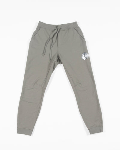 sage green lululemon sweatpant joggers with black and white Chicago Blackhawks primary logo on left thigh - front lay flat