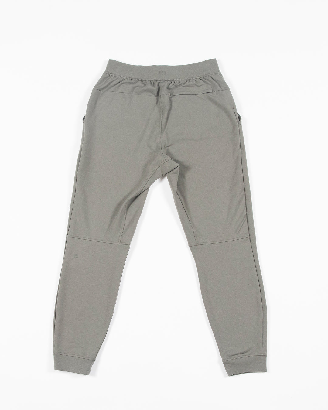 sage green lululemon sweatpant joggers with black and white Chicago Blackhawks primary logo on left thigh - back lay flat