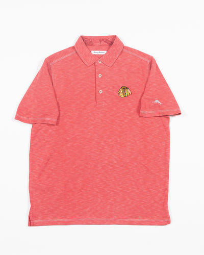 red Tommy Bahama polo with Chicago Blackhawks primary logo embroidered on left chest - front lay flat