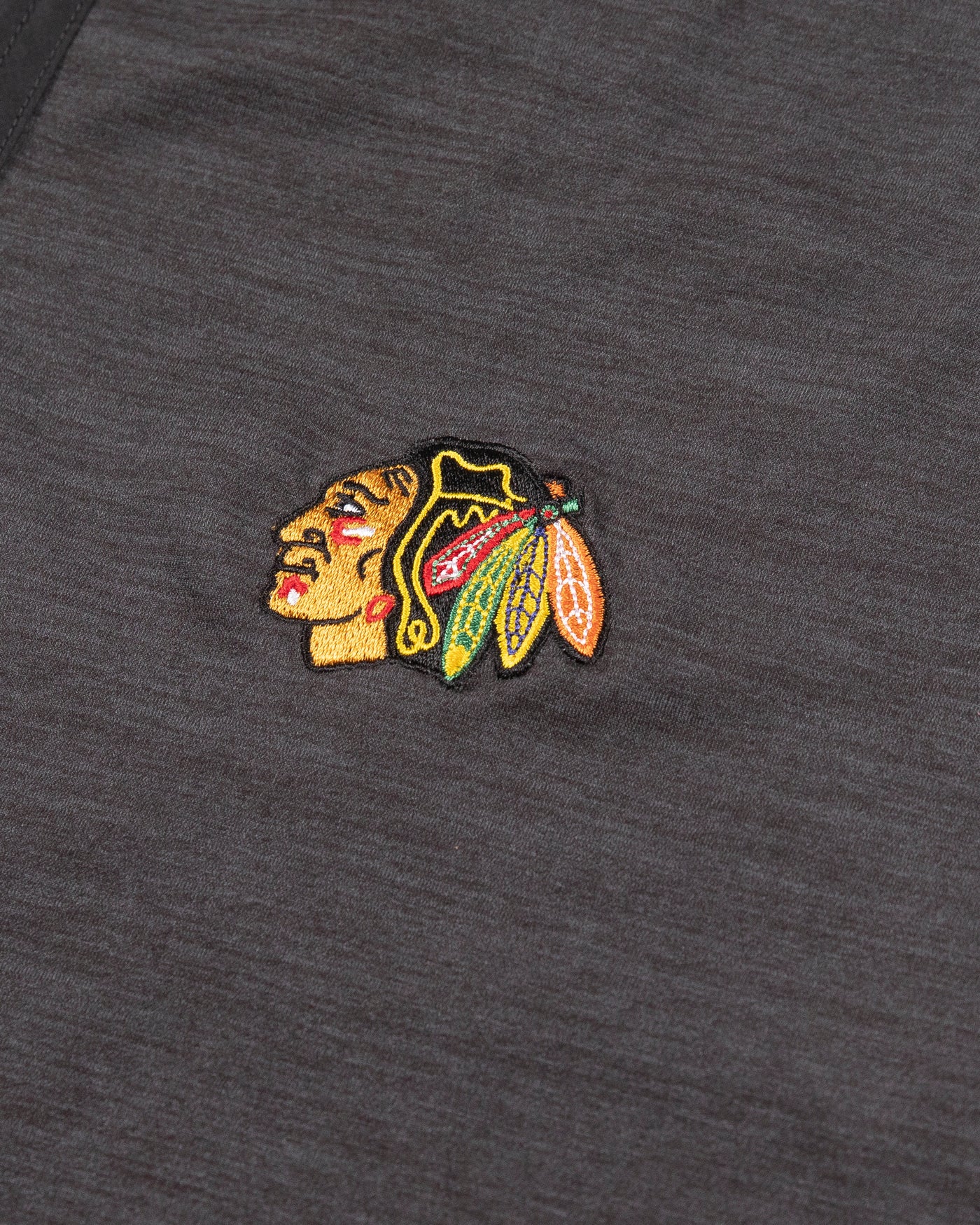 dark grey Tommy Bahama half zip with Chicago Blackhawks primary logo embroidered on left chest - detail logo lay flat