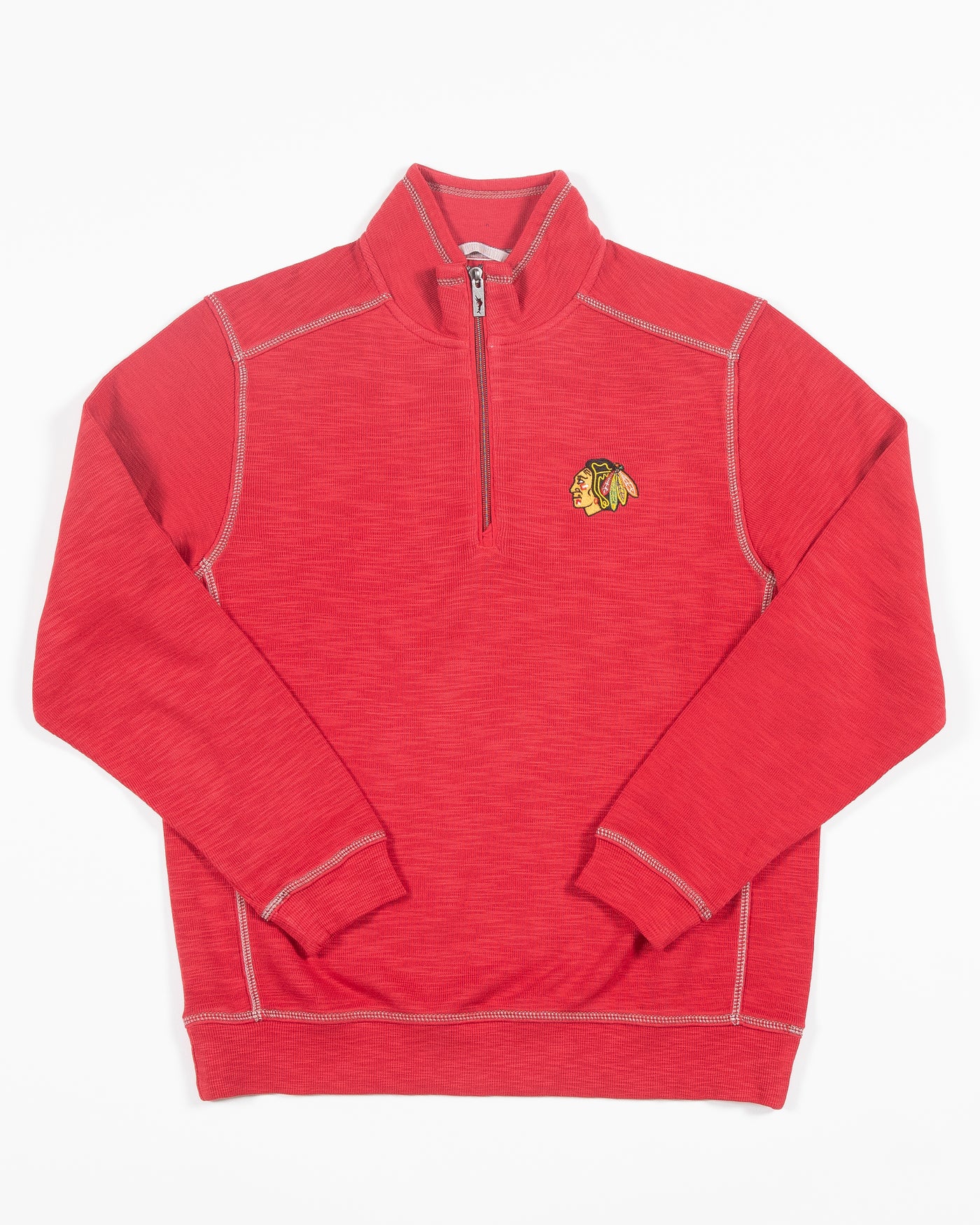 red Tommy Bahama half zip with Chicago Blacckhawks primary logo embroidered on left chest - front lay flat