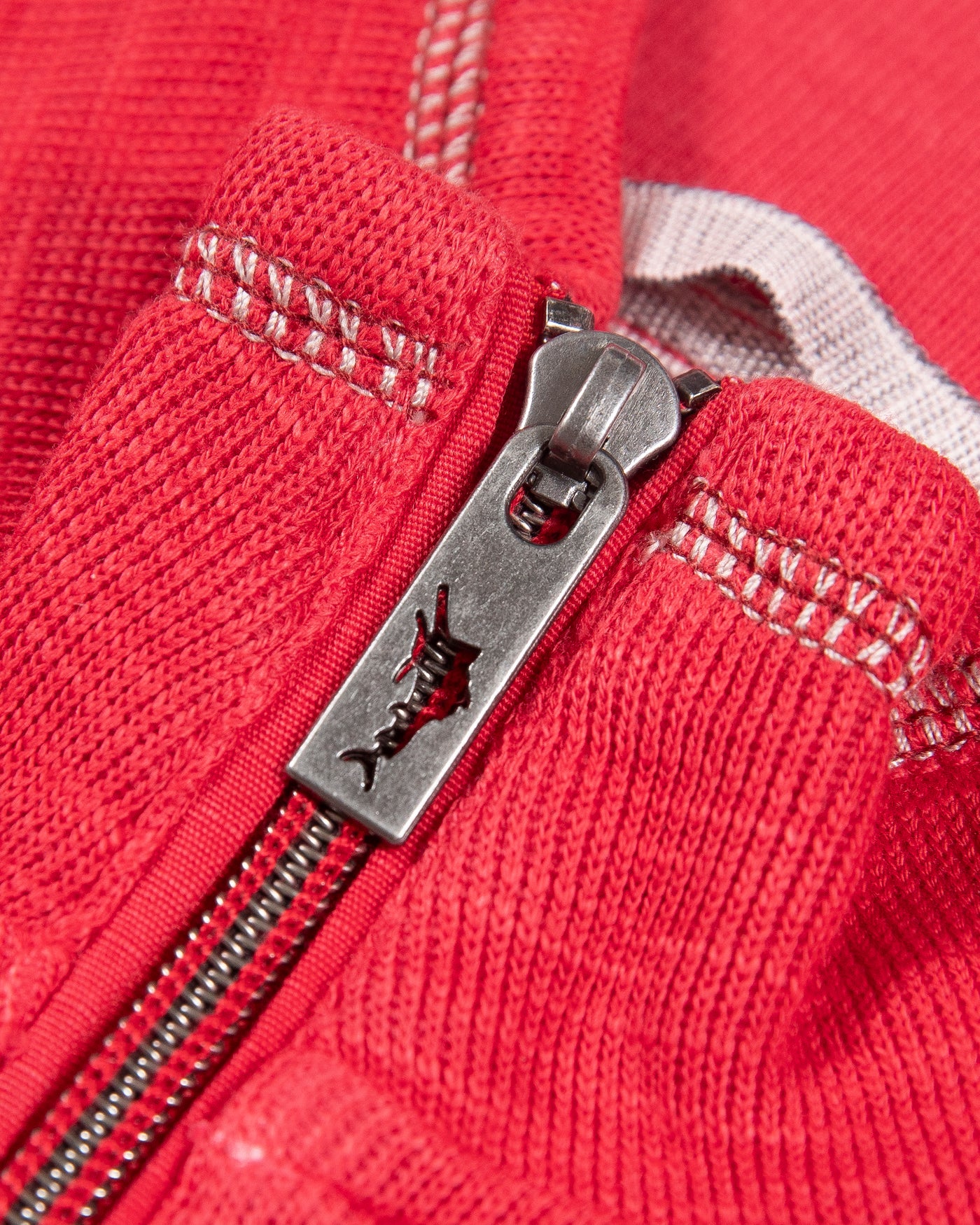red Tommy Bahama half zip with Chicago Blacckhawks primary logo embroidered on left chest - detail lay flat