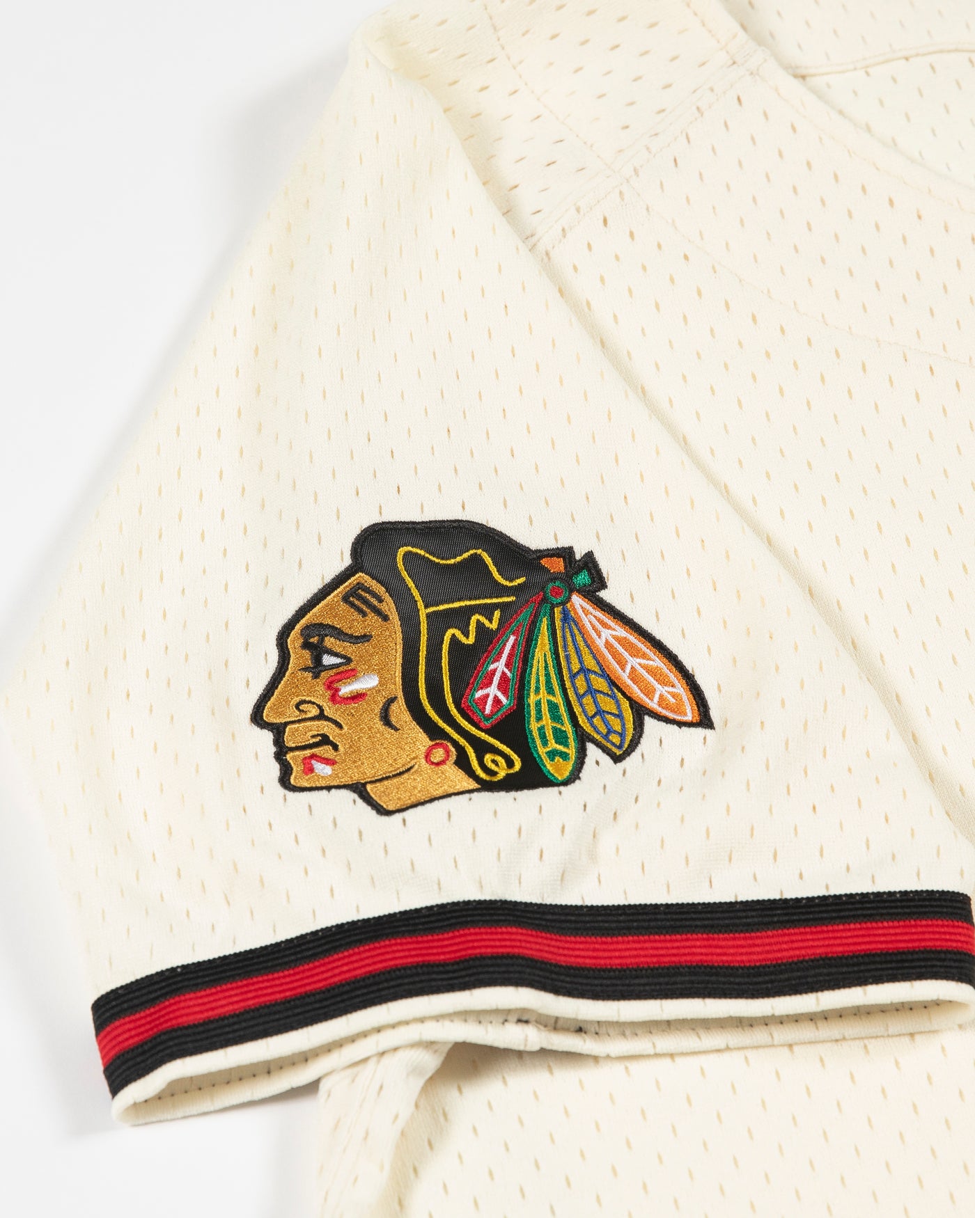 oatmeal Mitchell & Ness baseball inspired jersey with Chicago Blackhawks secondary logo on left chest and primary logo on right shoulder - primary logo on shoulder detail lay flat