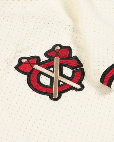 oatmeal Mitchell & Ness baseball inspired jersey with Chicago Blackhawks secondary logo on left chest and primary logo on right shoulder - secondary logo detail lay flat