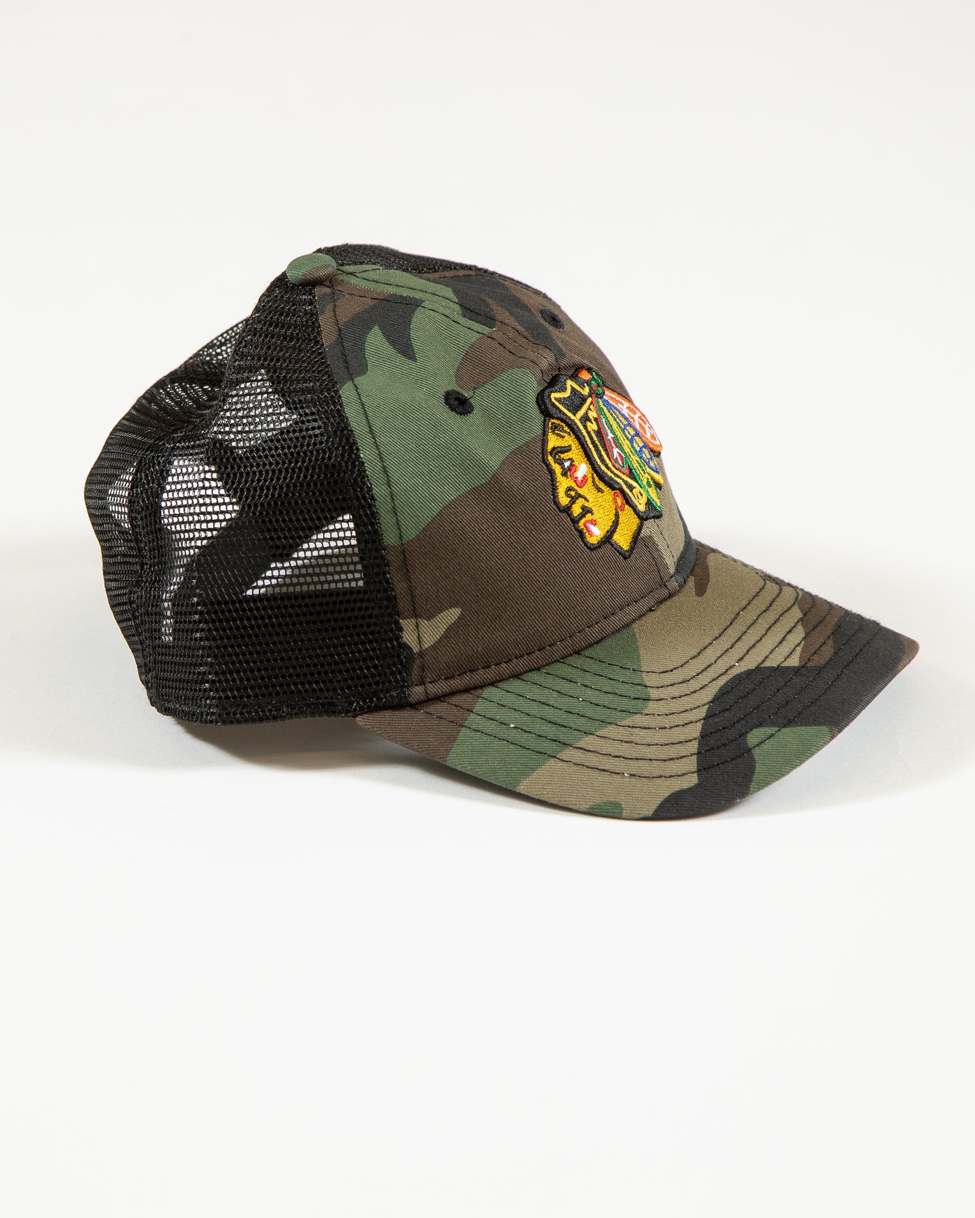 camo New Era youth trucker snapback with Chicago Blackhawks primary logo embroidered on front - right angle lay flat
