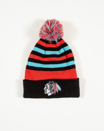 Four Stars knit hat with stripes and pom and Chicago Blackhawks primary logo in Chicago flag inspired colorway - front angle lay flat