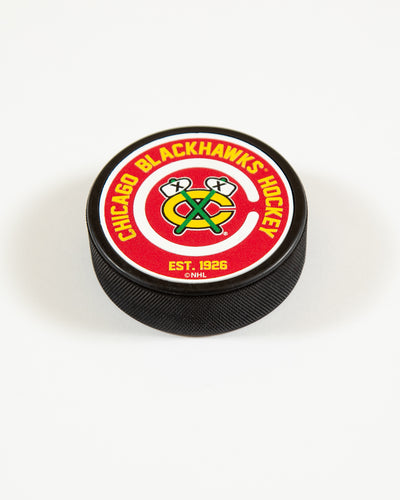 Chicago Blackhawks puck with secondary logo and word mark on front - angled lay flat