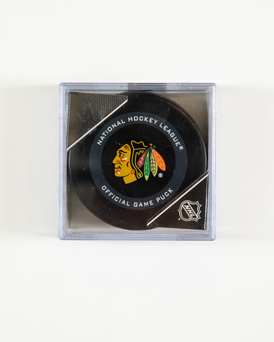 Chicago Blackhawks official game puck in plastic case - front angle lay flat