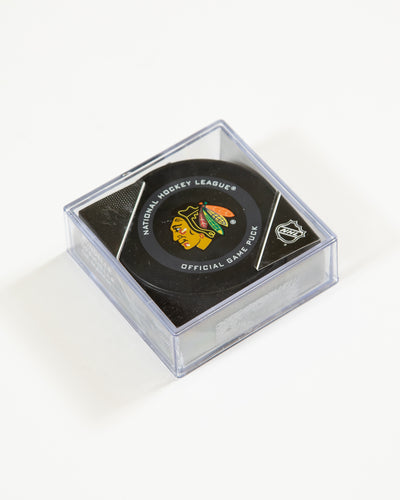 Chicago Blackhawks official game puck in plastic case - angled lay flat