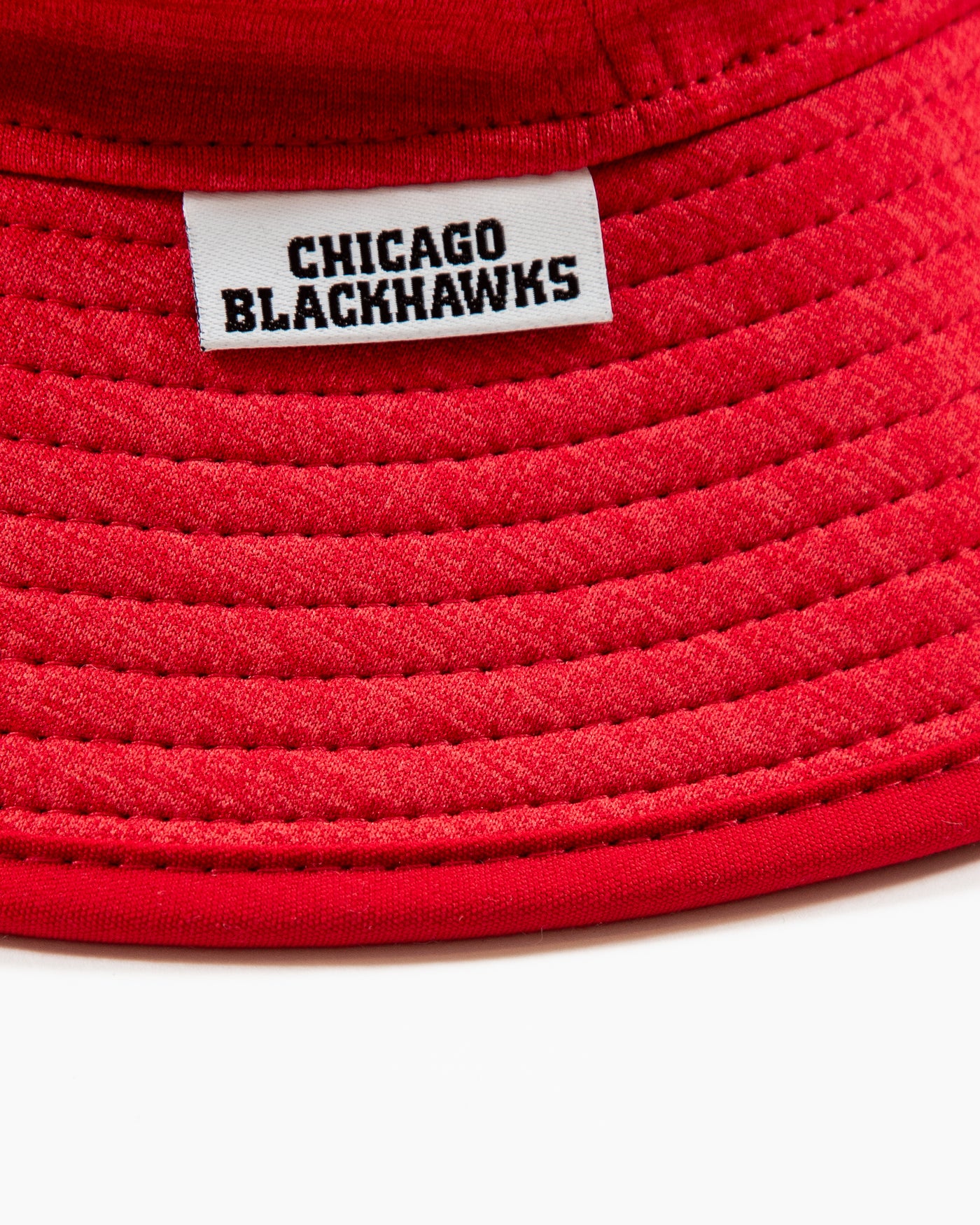 heather red New Era bucket hat with Chicago Blackhawks primary logo embroidered on front - detail lay flat