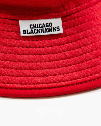 heather red New Era bucket hat with Chicago Blackhawks primary logo embroidered on front - detail lay flat