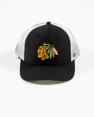 black and white '47 brand trucker cap with adjustable snapback closure and Chicago Blackhawks primary logo embroidered on front - front lay flat