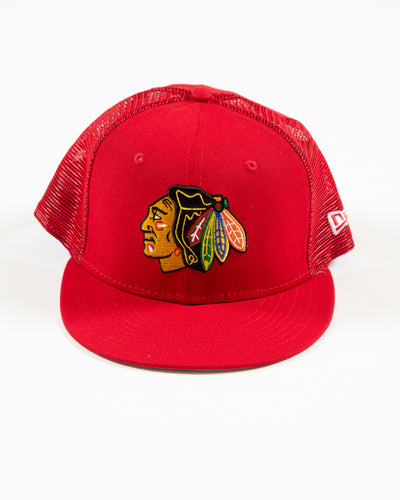 red New Era trucker hat with Chicago Blackhawks primary logo embroidered on front - front lay flat