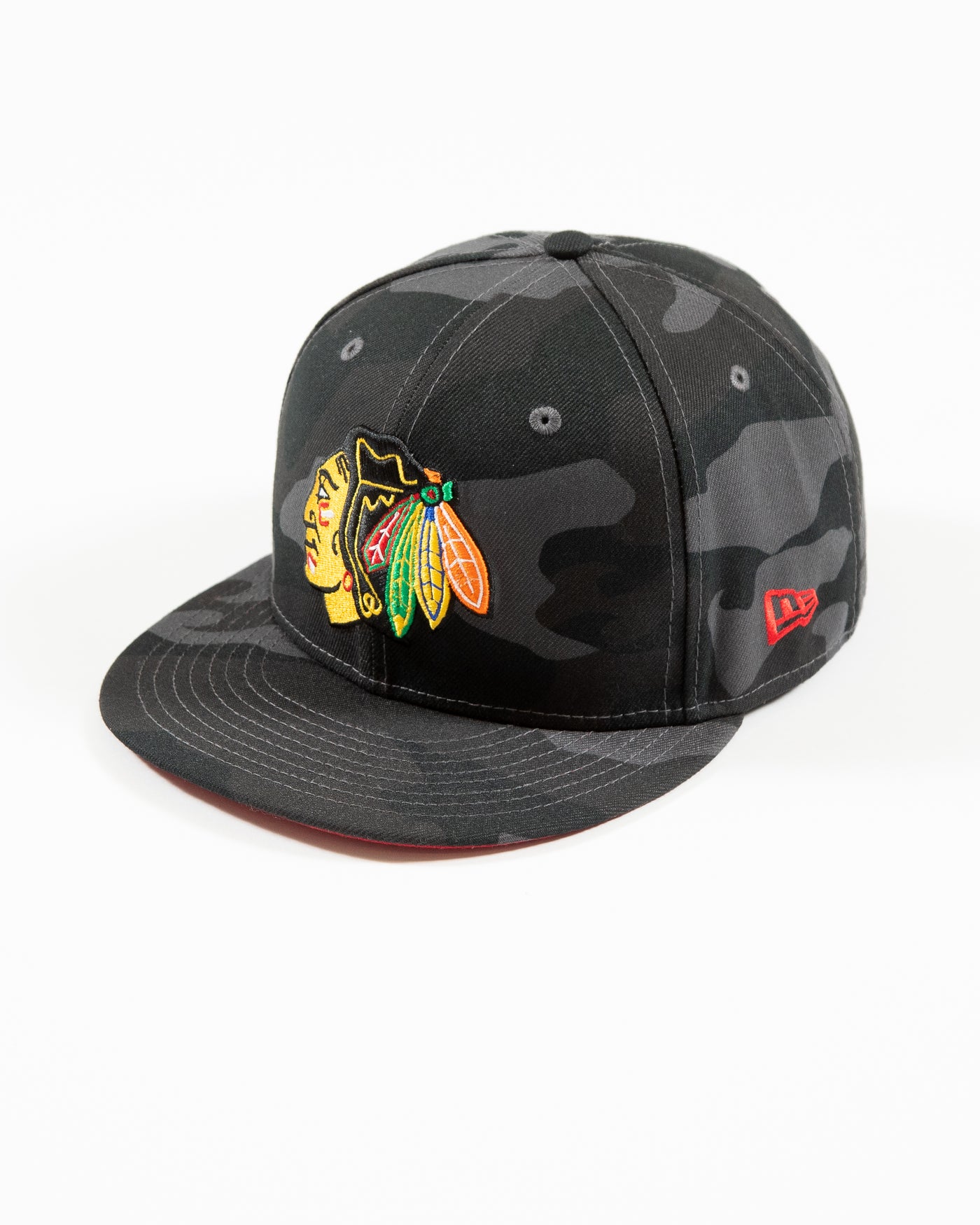 New Era black camo 59FIFTY fitted cap with Chicago Blackhawks primary logo embroidered on front - left angle lay flat