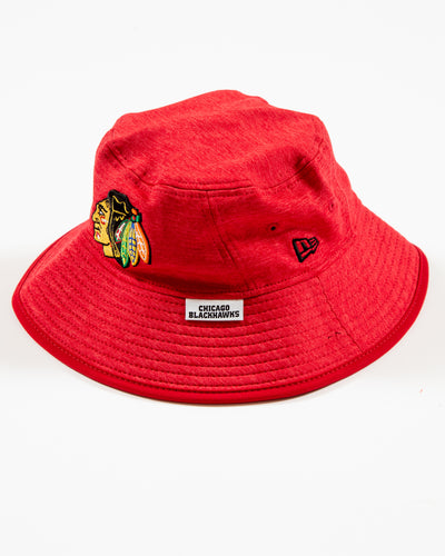 heather red New Era bucket hat with Chicago Blackhawks primary logo embroidered on front - left side angle lay flat