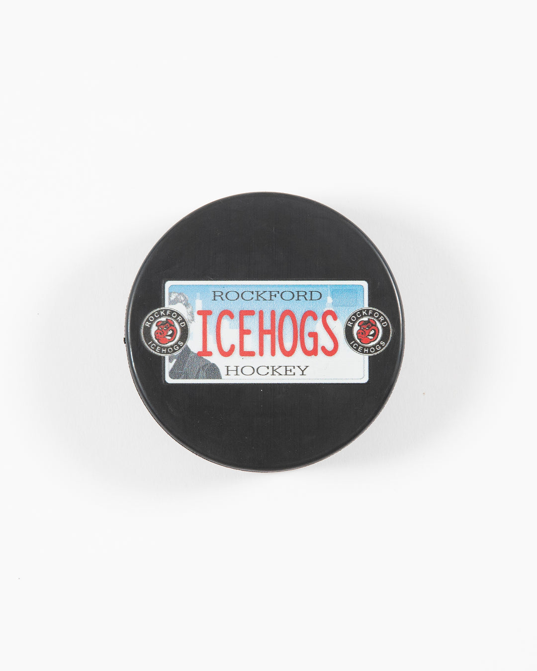 black hockey puck with Rockford IceHogs license plate inspired design - front lay flat