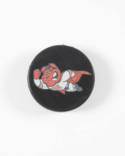 black hockey puck with Rockford IceHog Hammy in superhero outfit - front lay flat