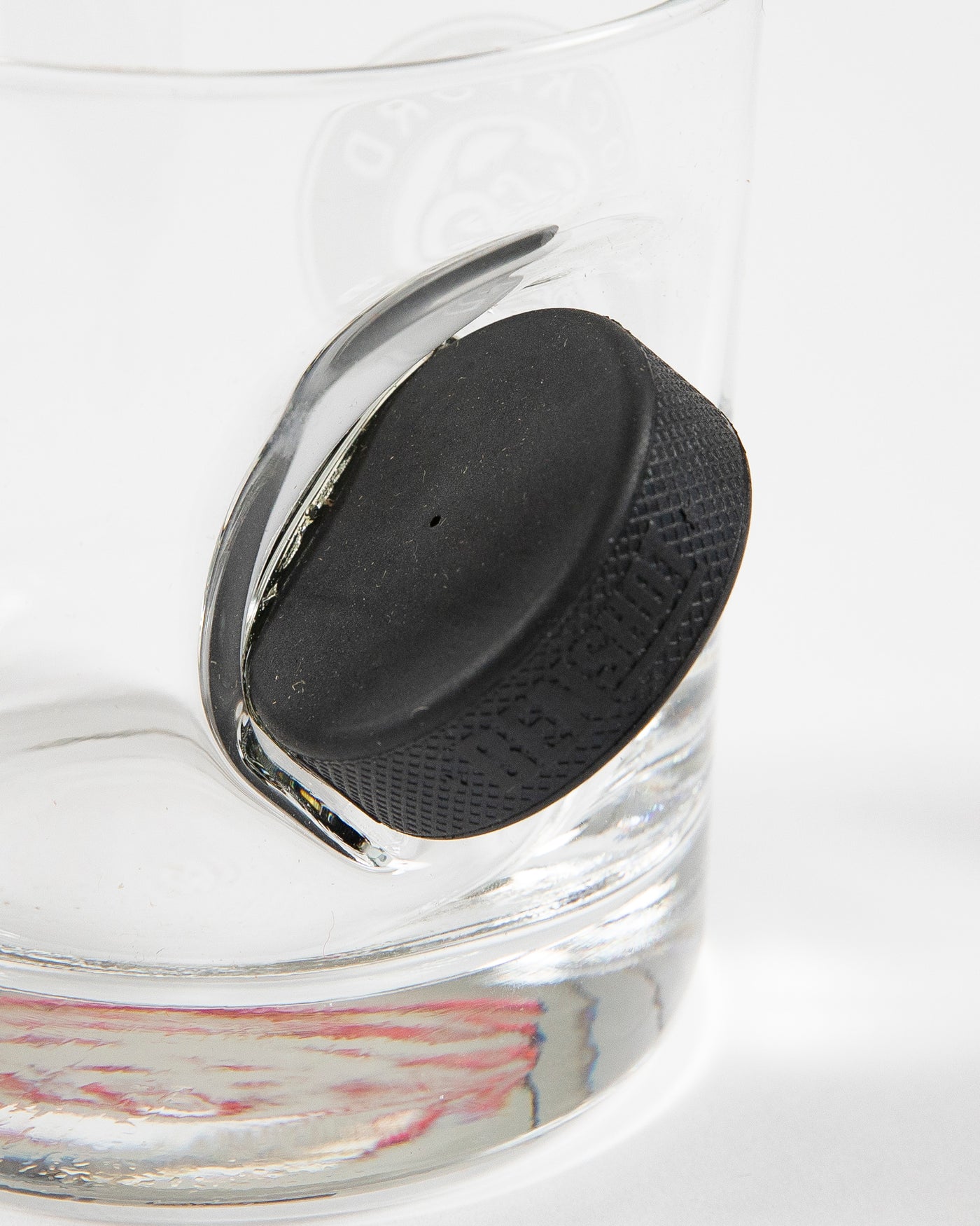 Rockford IceHogs rocks glass with puck going through glass - detail lay flat