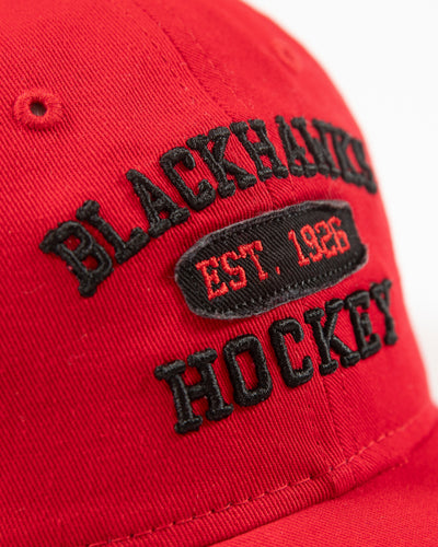 red New Era adjustable women's cap with Chicago Blackhawks collegiate inspired design embroidered on front - detail lay flat