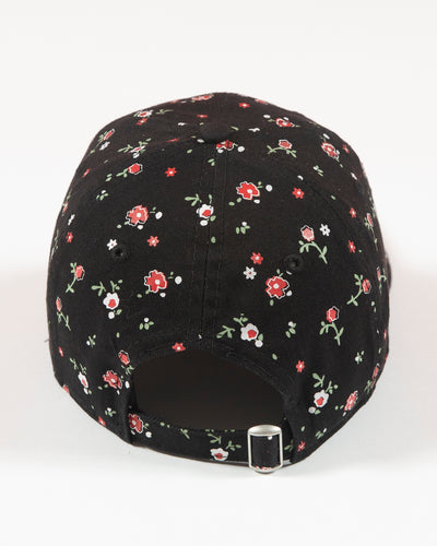 Black floral print New Era women's cap with Chicago Blackhawks primary logo embroidered on front - back lay flat
