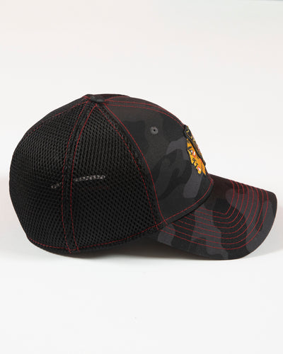 black camo New Era fitted cap with Chicago Blackhawks primary logo embroidered on front - right side lay flat