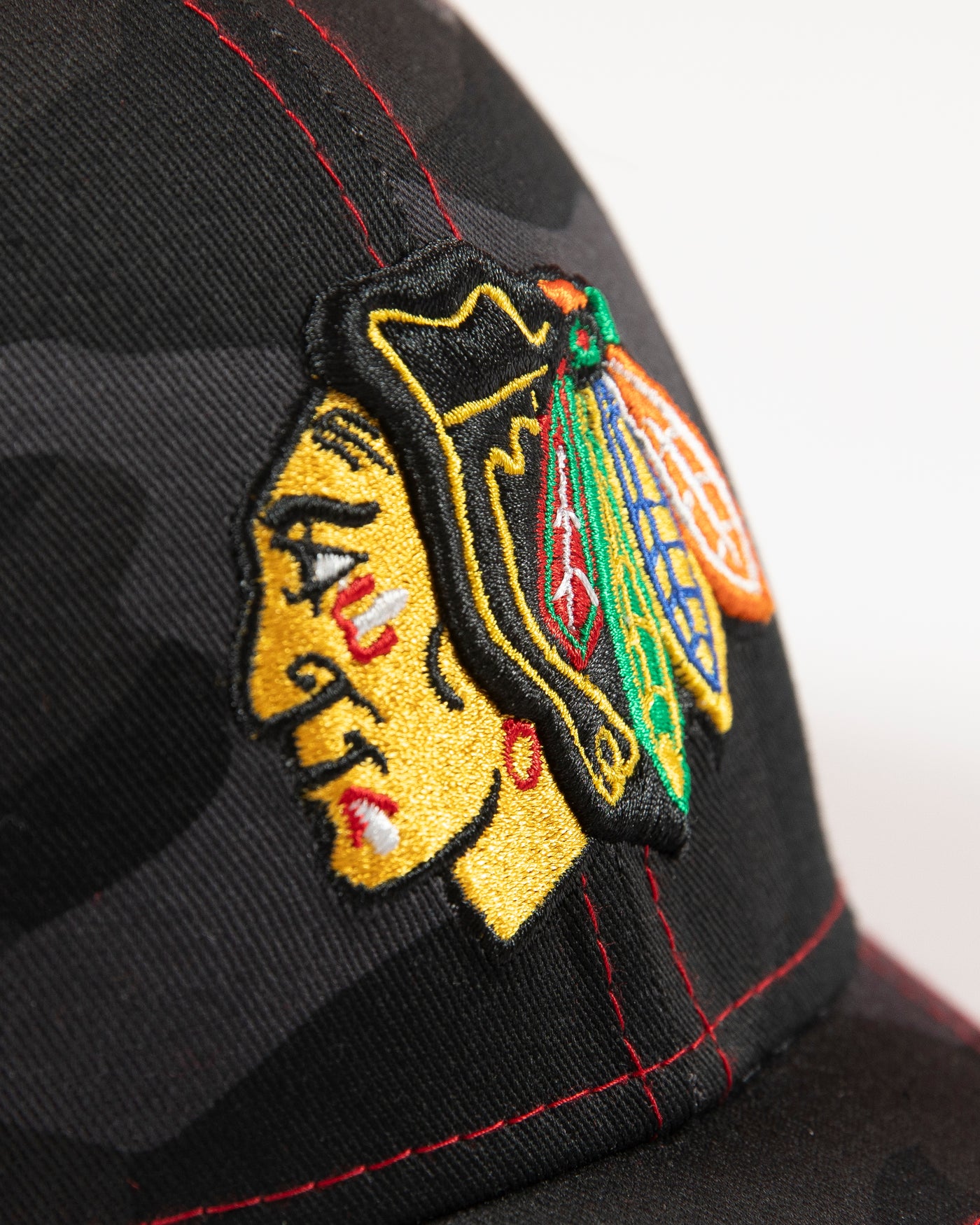 black camo New Era fitted cap with Chicago Blackhawks primary logo embroidered on front - detail lay flat