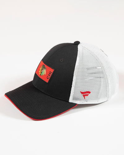 Fanatics two tone mesh trucker with Chicago Blackhawks primary logo patch on front - left angle lay flat