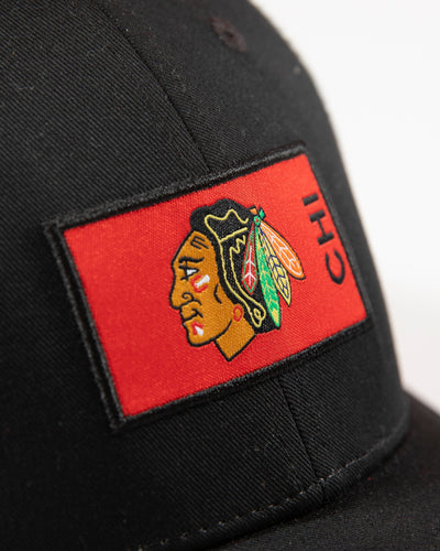 Fanatics two tone mesh trucker with Chicago Blackhawks primary logo patch on front - detail lay flat