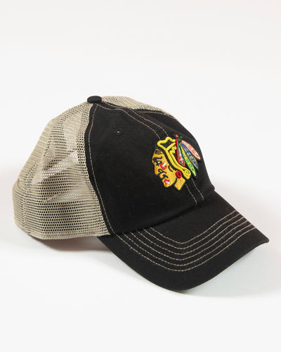 '47 adjustable clean up cap with Chicago Blackhawks primary logo embroidered on front in an all over black and tan colorway - right angle lay flat