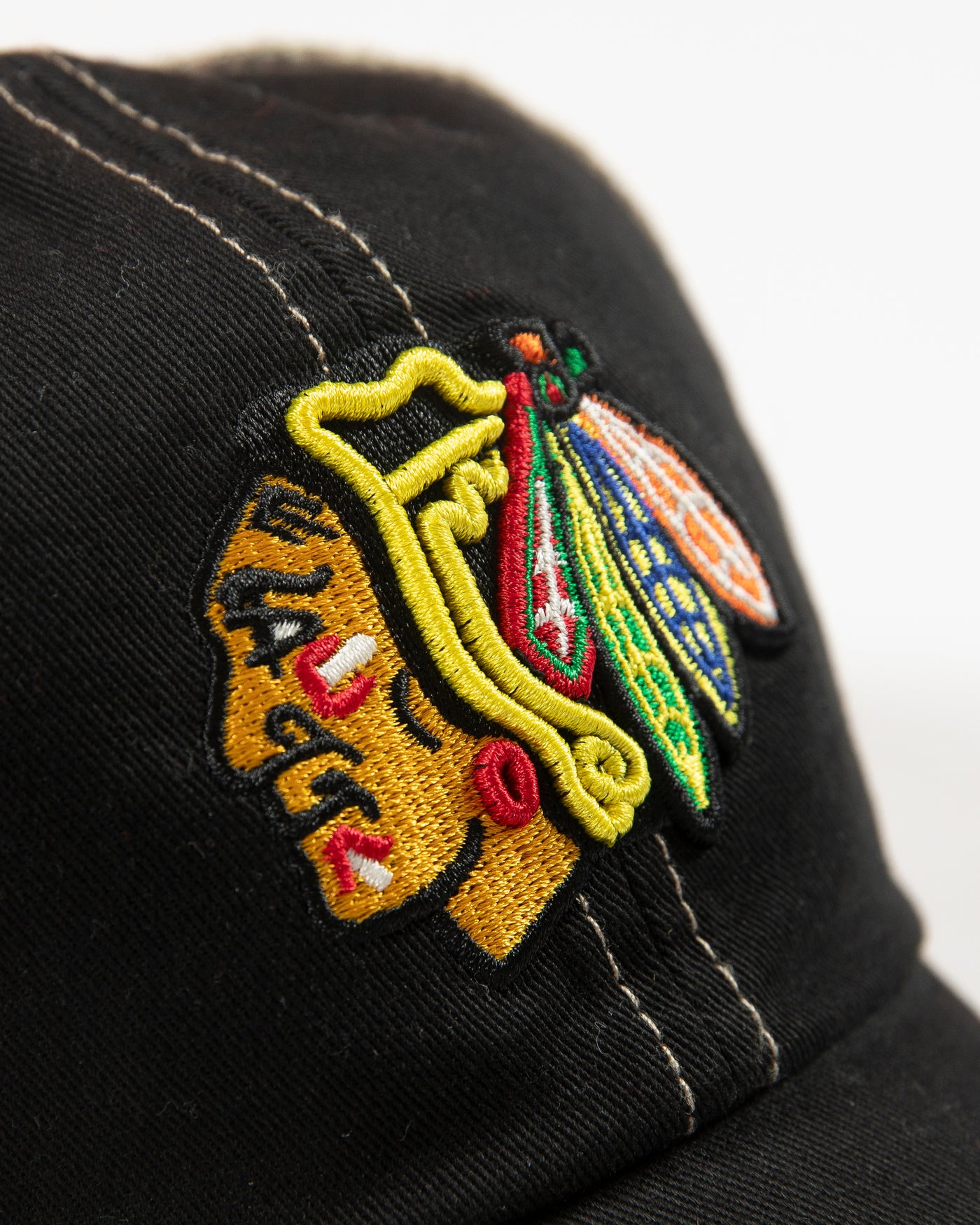 '47 adjustable clean up cap with Chicago Blackhawks primary logo embroidered on front in an all over black and tan colorway - detail lay flat