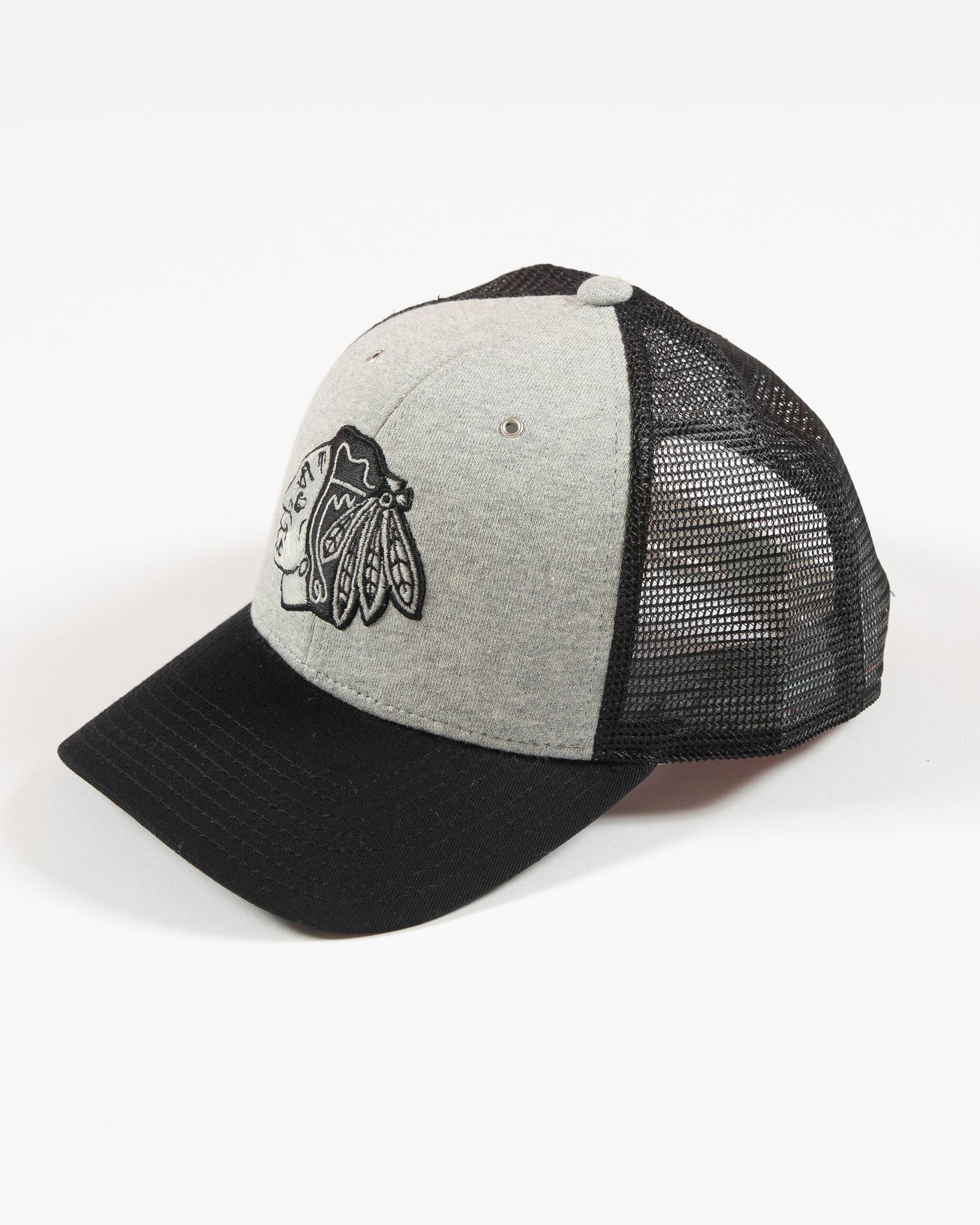 Grey CCM trucker cap with Chicago Blackhawks primary logo embroidered on front - left angle lay flat