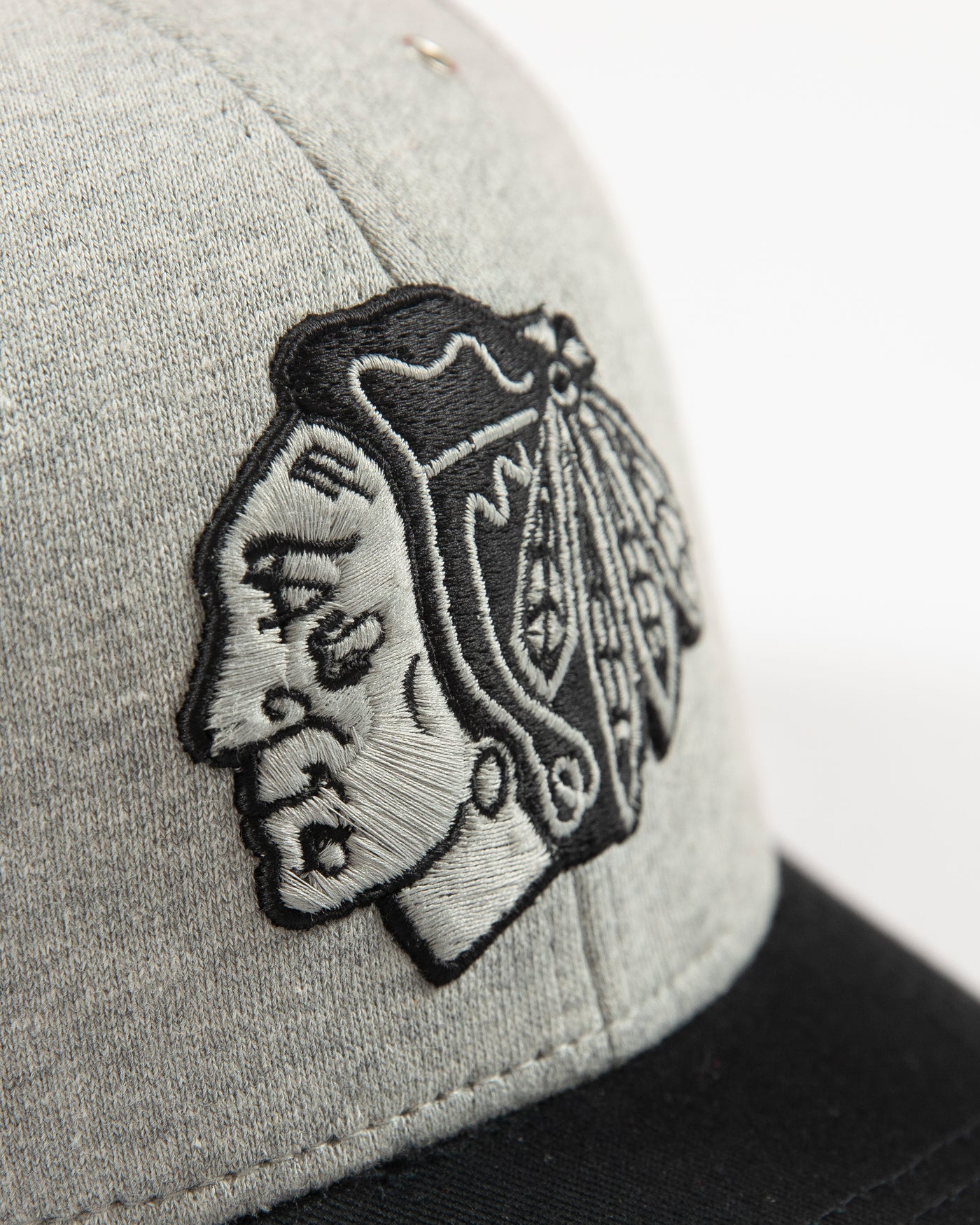 Grey CCM trucker cap with Chicago Blackhawks primary logo embroidered on front - detail lay flat