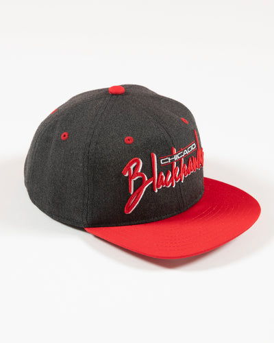 Outerstuff faded black and red Chicago Blackhawks wordmark youth cap - right angle lay flat