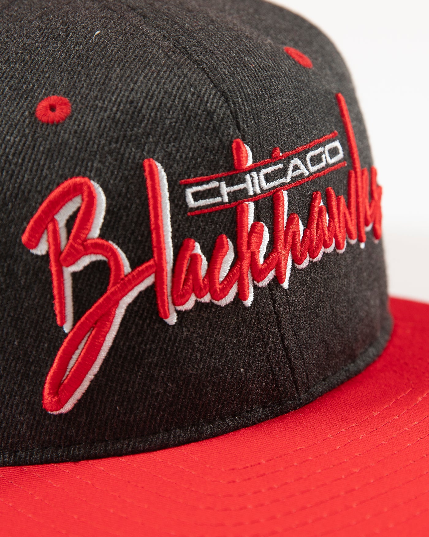 Outerstuff faded black and red Chicago Blackhawks wordmark youth cap - detail lay flat