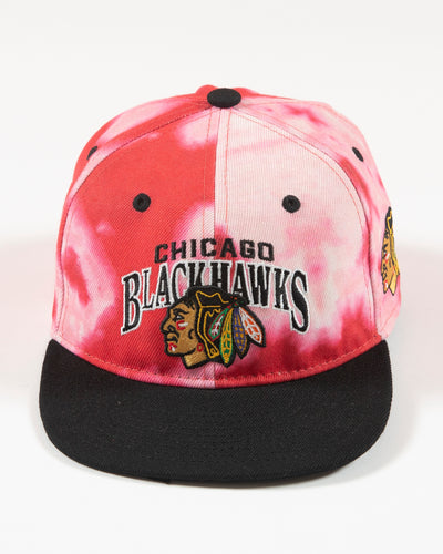 Outerstuff red bleached youth snapback with Chicago Blackhawks wordmark and primary logo embroidered on front - front lay flat