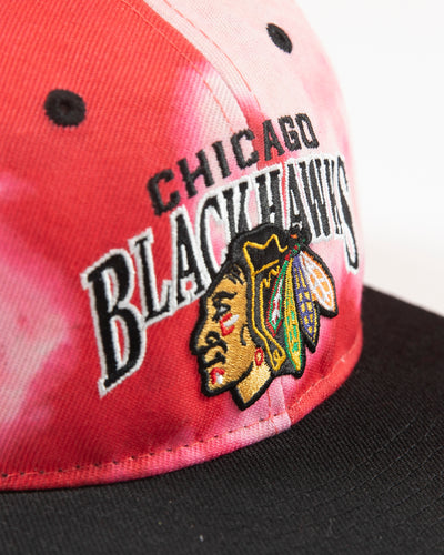 Outerstuff red bleached youth snapback with Chicago Blackhawks wordmark and primary logo embroidered on front - detail lay flat
