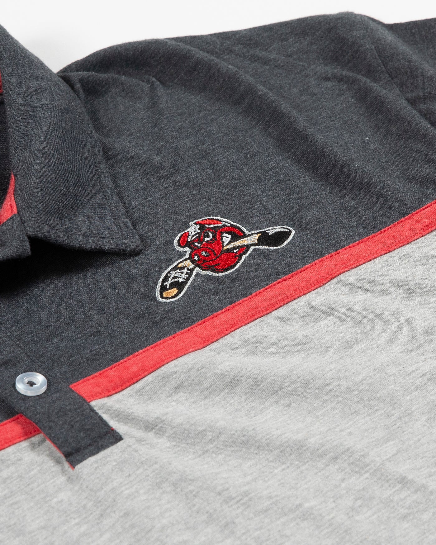 Colosseum two tone grey polo with Rockford IceHogs logo embroidered on upper left chest - detail lay flat