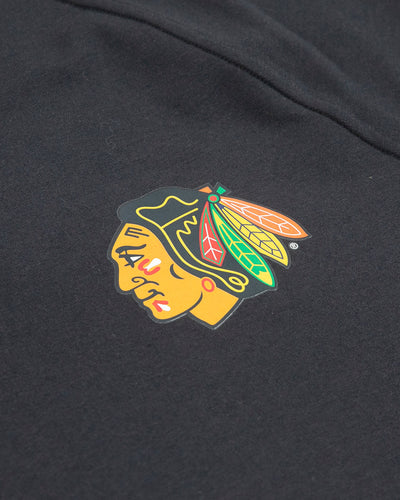 black lululemon crewneck sweater with Chicago Blackhawks primary logo on left chest - detail lay flat