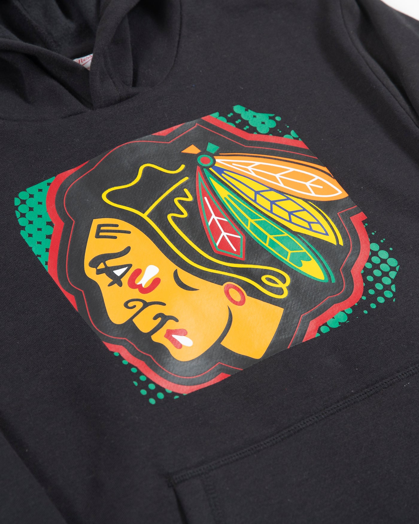 black Mitchell & Ness youth hoodie with Chicago Blackhawks primary logo across chest and Chicago wordmark along left sleeve - detail lay flat