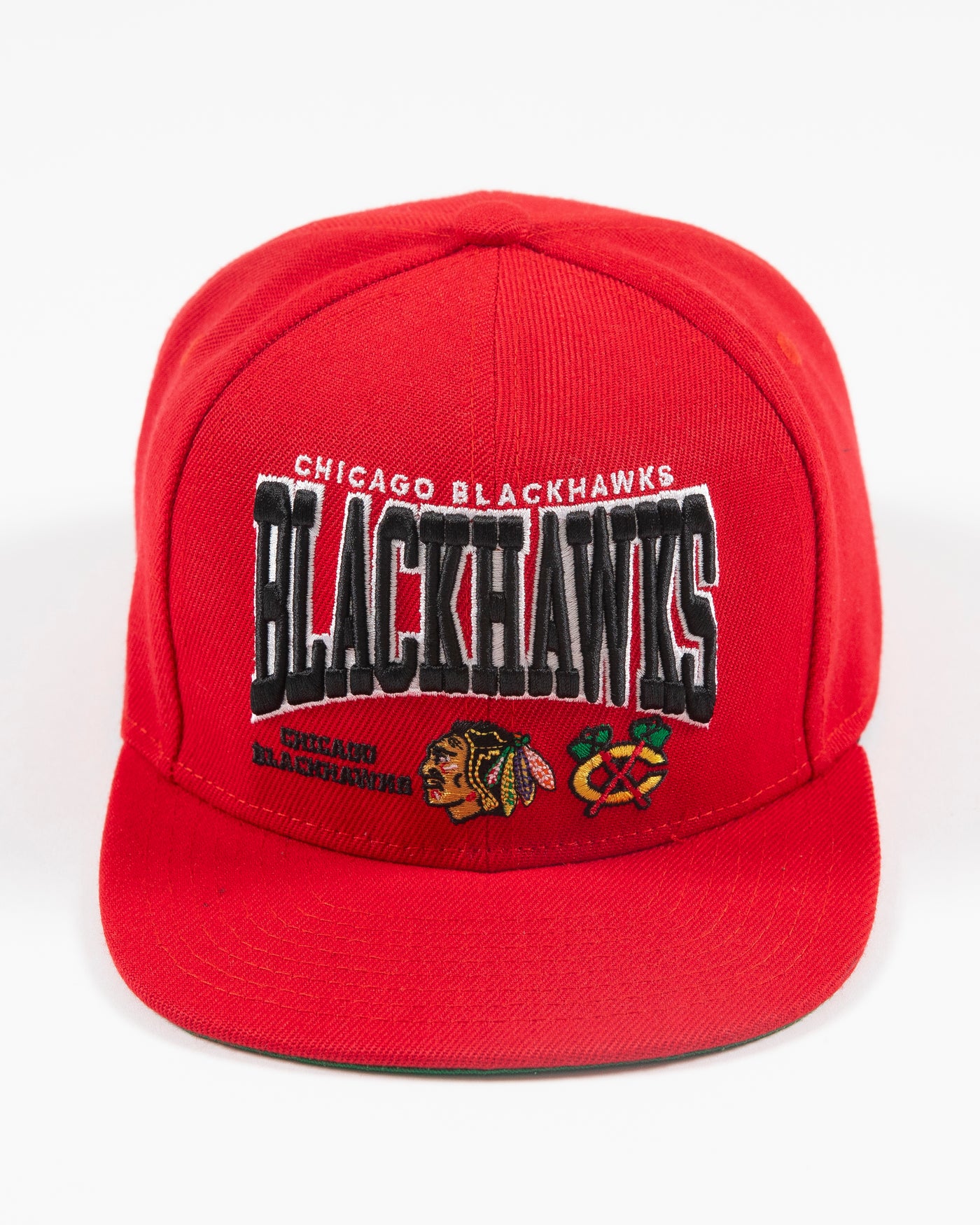 red Mitchell & Ness youth snapback with Chicago Blackhawks wordmark graphic and primary and secondary logos embroidered on front - front lay flat