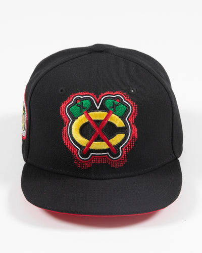 black Mitchell & Ness snapback with Chicago Blackhawks secondary logo embroidered on front and primary logo patch embroidered on right side - front lay flat 