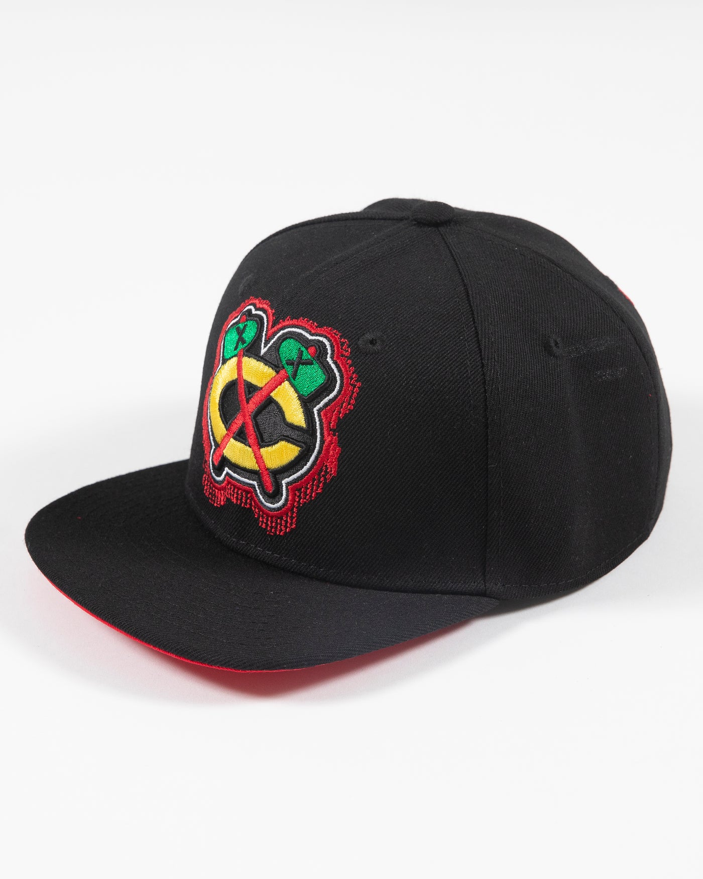 black youth Mitchell & Ness snapback cap with Chicago Blackhawks secondary tomahawk logo embroidered on front and 75th anniversary patch embroidered on right side - left angle lay flat