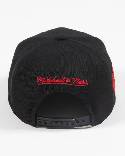 black youth Mitchell & Ness snapback cap with Chicago Blackhawks secondary tomahawk logo embroidered on front and 75th anniversary patch embroidered on right side - back lay flat