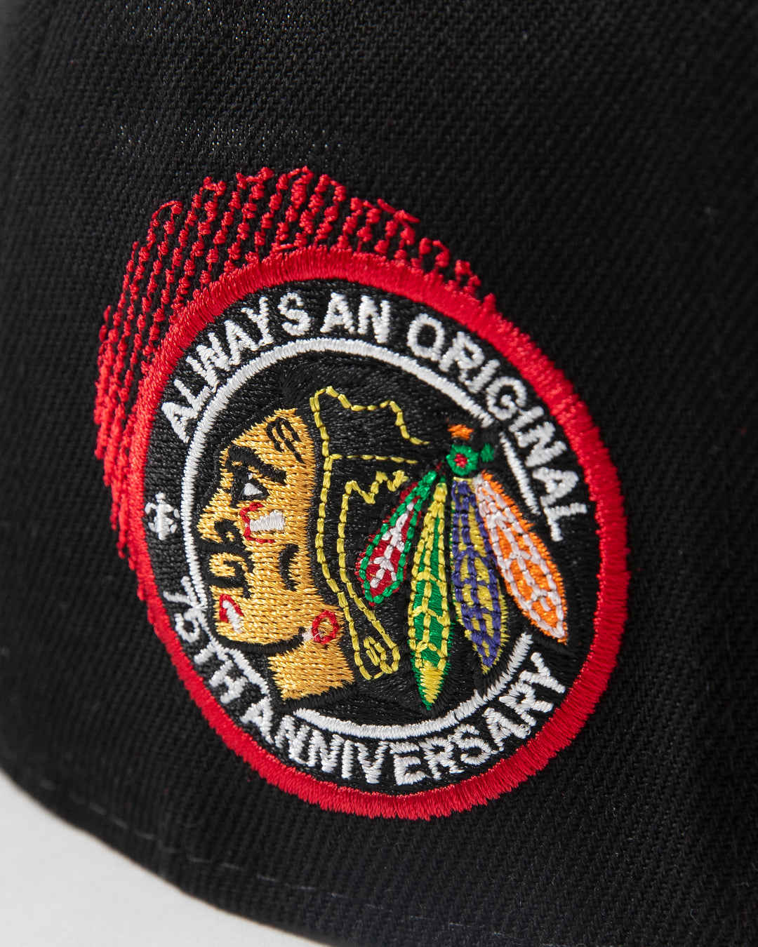 black Mitchell & Ness snapback with Chicago Blackhawks secondary logo embroidered on front and primary logo patch embroidered on right side - detail right side lay flat 