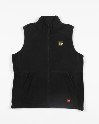 black Sporiqe flece full zip vest with Chicago Blakhawks primary logo on left chest - front lay flat