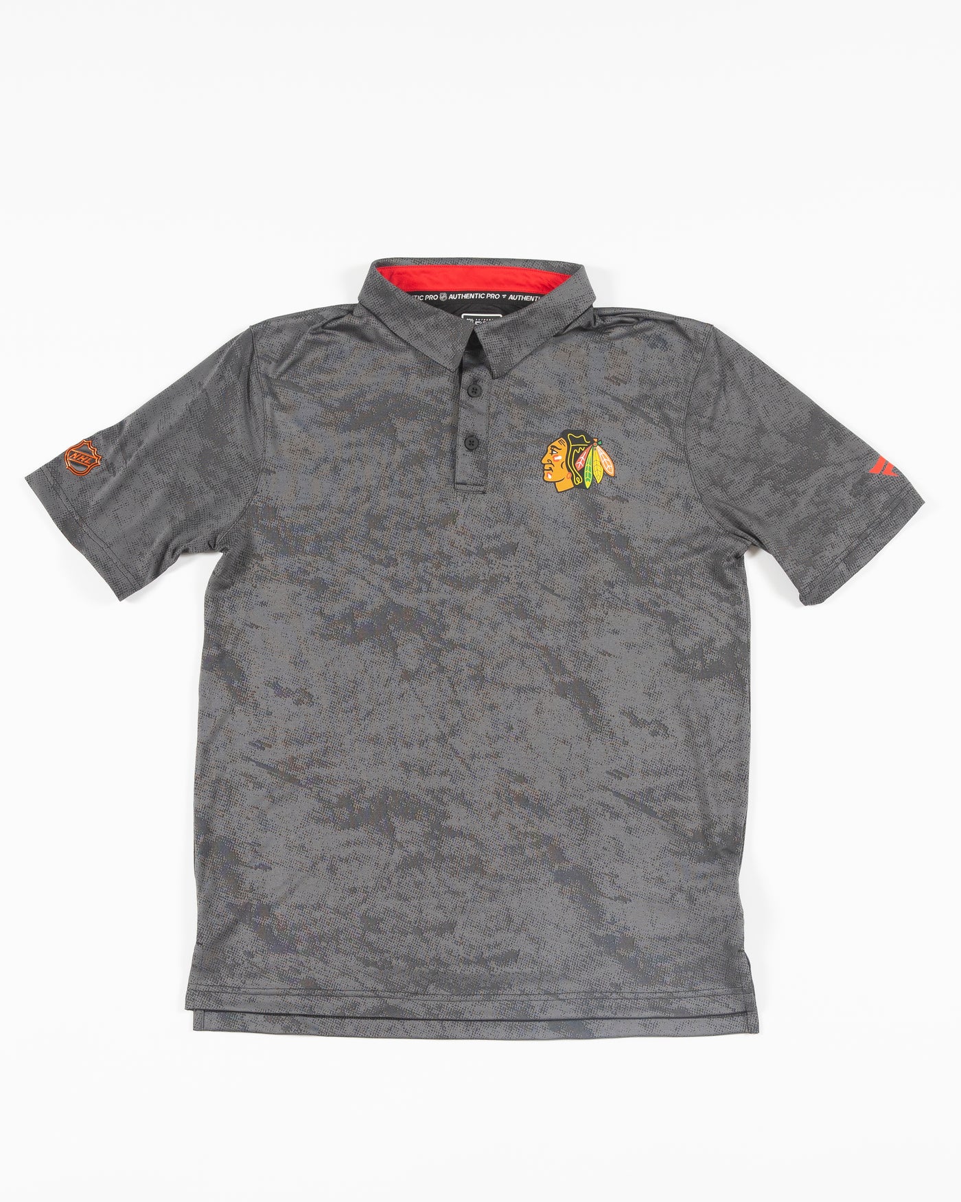 black Fanatics polo with Chicago Blackhawks primary logo on left chest - front lay flat