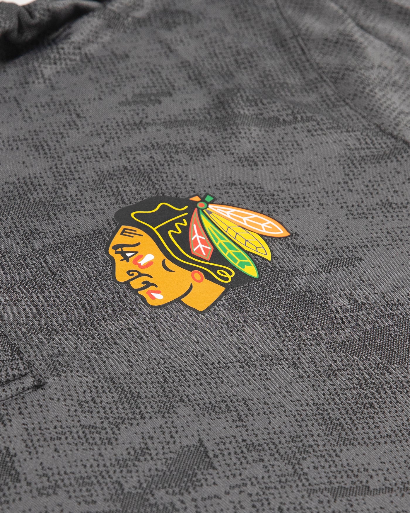 black Fanatics polo with Chicago Blackhawks primary logo on left chest - detail lay flat