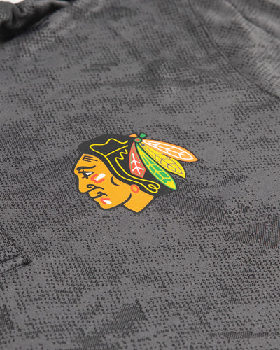 black Fanatics polo with Chicago Blackhawks primary logo on left chest - detail lay flat