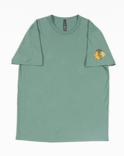 green lululemon t-shirt with Chicago Blackhawks primary logo on left shoulder - front lay flat