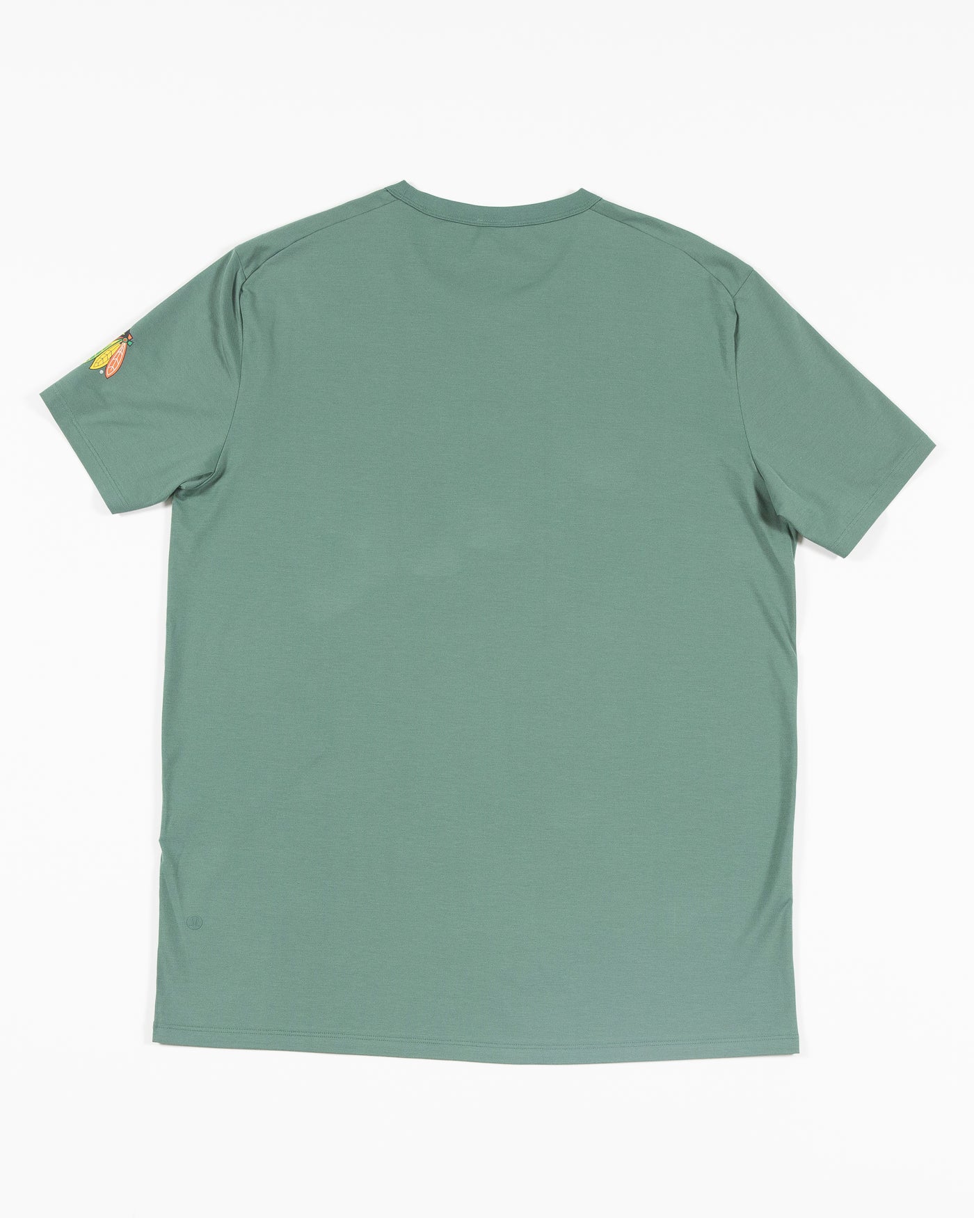 green lululemon t-shirt with Chicago Blackhawks primary logo on left shoulder - back lay flat